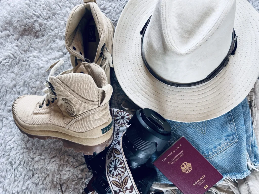 Hiking boots, hat, camera and other items that should be in your Namibia Packing List